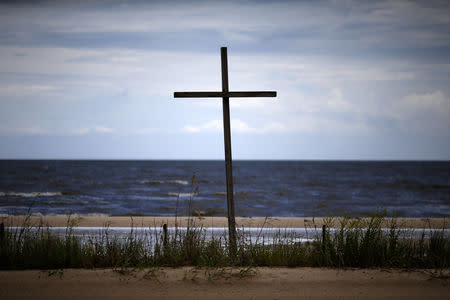 A wooden cross is seen as Tropical Storm Gordon approaches Waveland, Mississippi, U.S., September 4, 2018. REUTERS/Jonathan Bachman