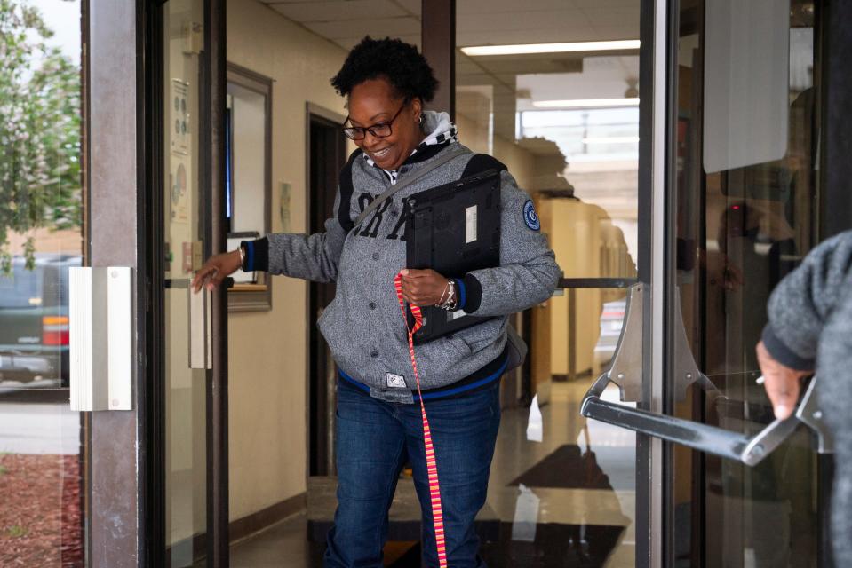 Tonya Hogan, 50, exits the Harbor Light Salvation Army after packing all of her belongings in Detroit on Monday, May 1, 2023. "I shut the door and I didn't even look back," said Hogan, who found shelter at the Salvation Army after the unexpected death of her husband.