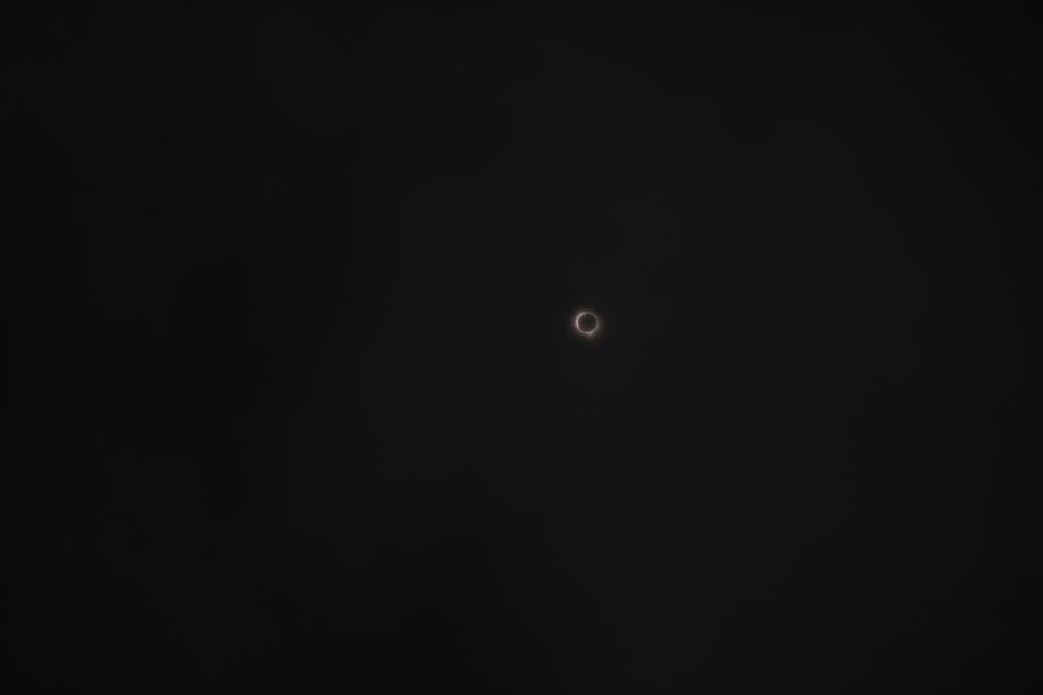 View of the total solar eclipse in downtown Austin on Monday, April 8, 2024.