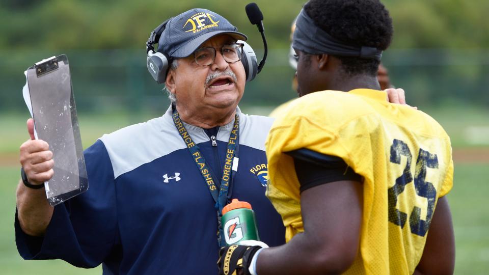 Florence High School football coach Joe Frappolli instructs Florence player Kosisonna Onunkuo as Florence hosts Overbrook in a scrimmage on Thursday, August 24, 2023.  Frappolli is entering his 50th season coaching the Florence Flash.