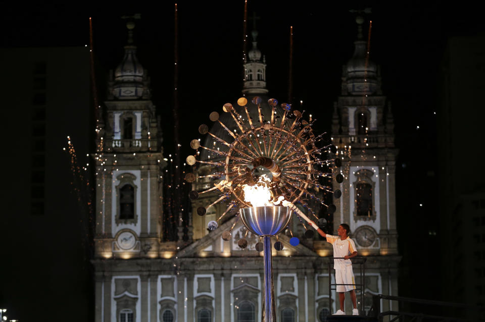 Jorge Alberto Oliveira Gomes lights the Olympic cauldron during the opening ceremony of the 2016 Summer Olympics in Rio de Janeiro, Brazil, Saturday, Aug. 6, 2016. (AP Photo/Natacha Pisarenko)