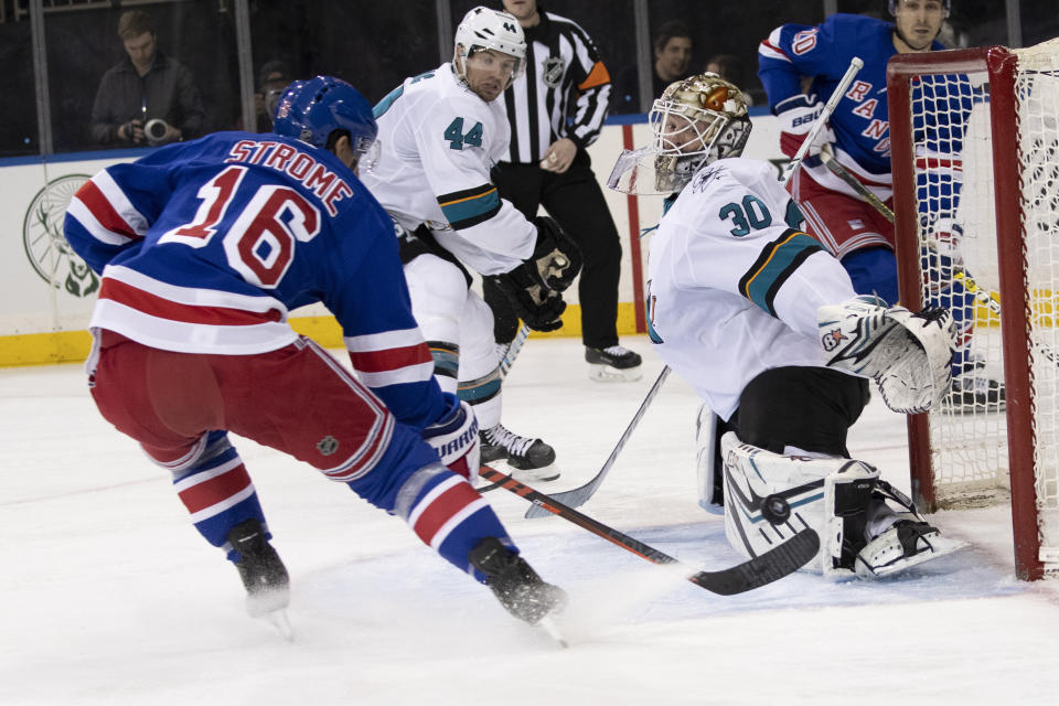 San Jose Sharks goaltender Aaron Dell (30) makes a save against New York Rangers center Ryan Strome (16) during the second period of an NHL hockey game, Saturday, Feb. 22, 2020, at Madison Square Garden in New York. (AP Photo/Mary Altaffer)