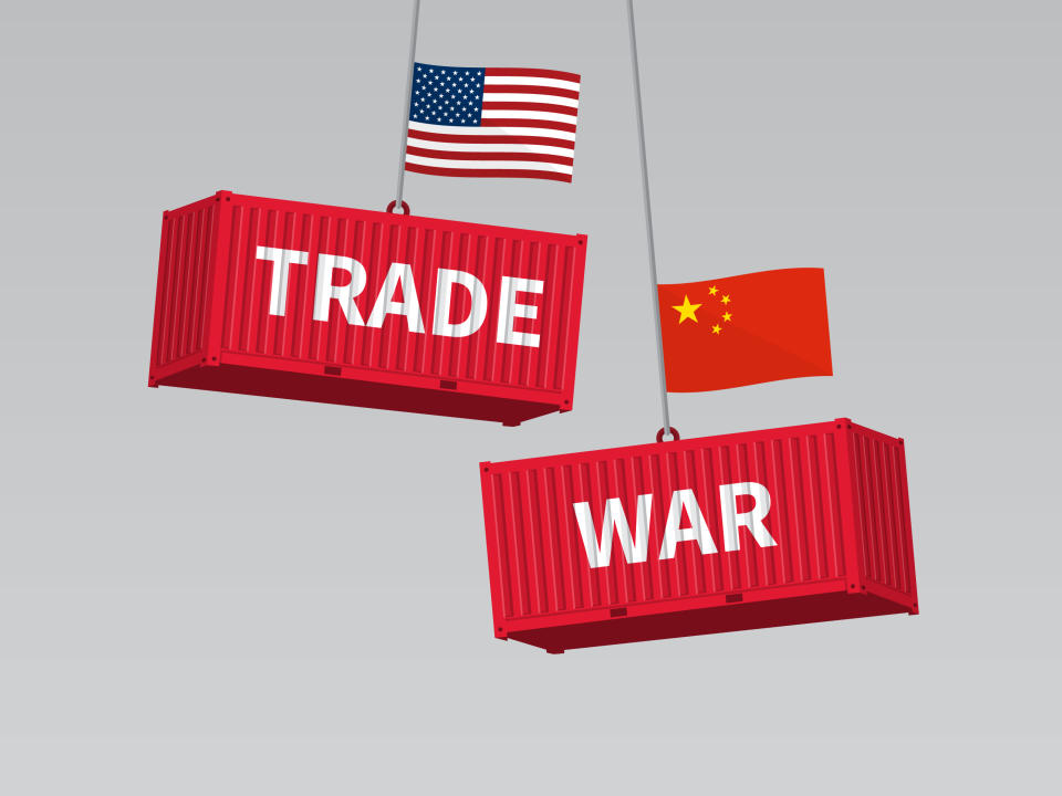 Cargo containers read trade war and carry American and Chinese flags