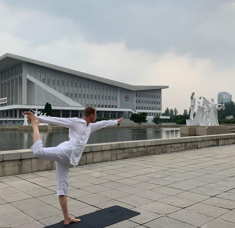 Swedish Ambassador Joachim Bergstrom practices yoga near the Pyongyang Gymnasium in Pyongyang