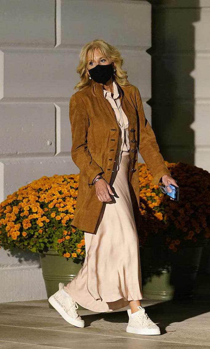 First lady Jill Biden walks out of the White House ahead of President Joe Biden as they prepare to board Marine One. - Credit: AP