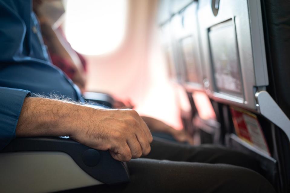 There are different opinions as to who should be allowed which armrest. Getty Images/iStockphoto