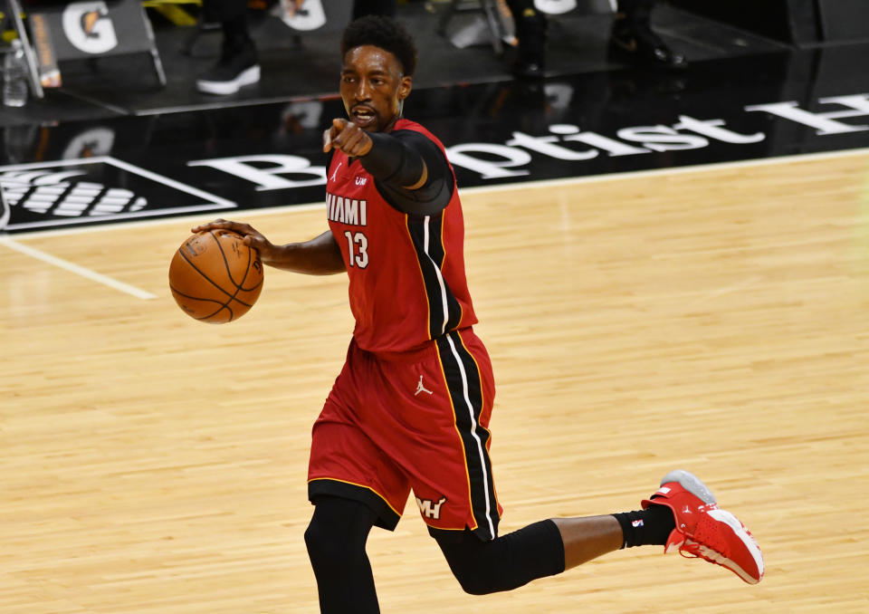 Jan 16, 2021; Miami, Florida, USA; Miami Heat center Bam Adebayo (13) brings the ball up the court against the Detroit Pistons at American Airlines Arena. 