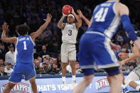 Georgetown guard James Akinjo (3) shoots during the second half as Duke center Vernon Carey Jr. (1) defends during the second half of an NCAA college basketball game in the 2K Empire Classic, Friday, Nov. 22, 2019 in New York. Duke won 81-73. (AP Photo/Kathy Willens)