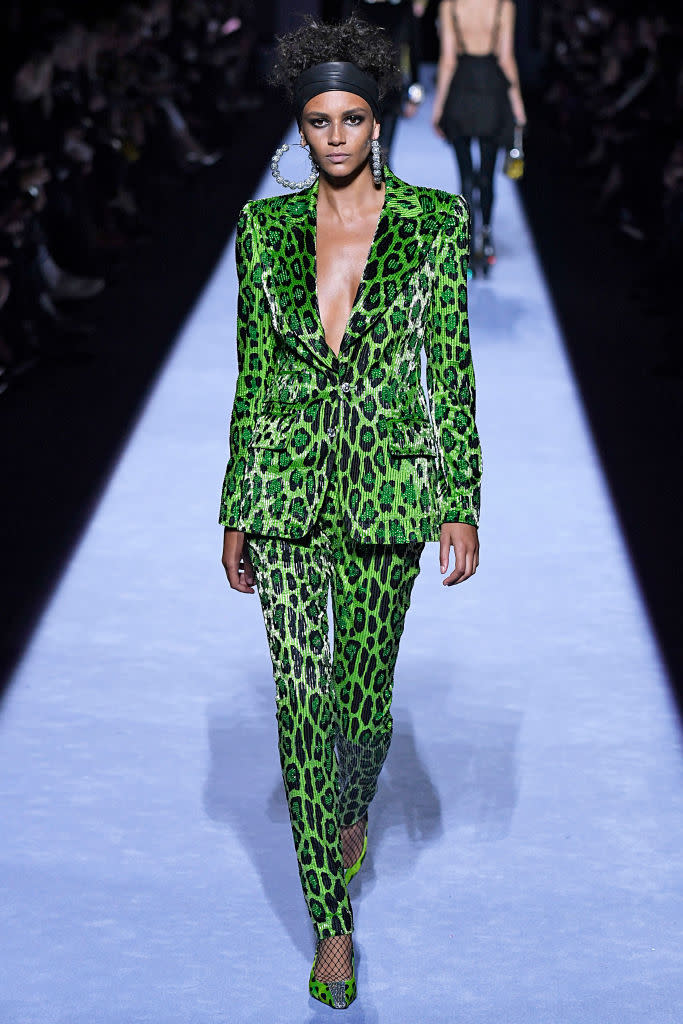 <p>Model wears a green leopard pantsuit at the fall 2018 Tom Ford show. (Photo: Getty Images) </p>