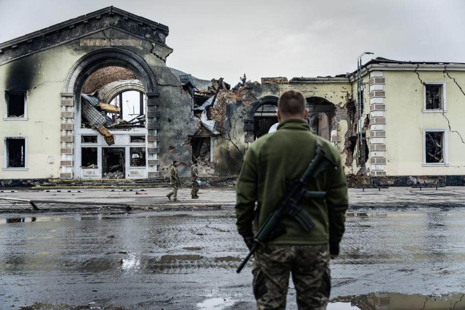 A Ukrainian soldier stands in front of railroad station destroyed as result of Russian shelling in Kostiantynivka, Ukraine on March 15, 2024. On Feb. 25, the Russian army attacked Kostiantynivka from air, resulting in destruction of the city's railroad station and damage of a church, residential buildings, stores, educational institutions, and administrative buildings. (Serhii Mykhalchuk/Global Images Ukraine via Getty Images)