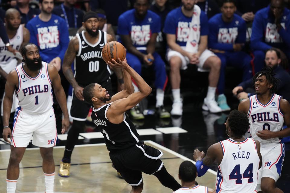 Brooklyn Nets' Mikal Bridges (1) shoots over Philadelphia 76ers' Paul Reed (44) during the second half of Game 4 in an NBA basketball first-round playoff series Saturday, April 22, 2023, in New York. The 76ers won 96-88. (AP Photo/Frank Franklin II)