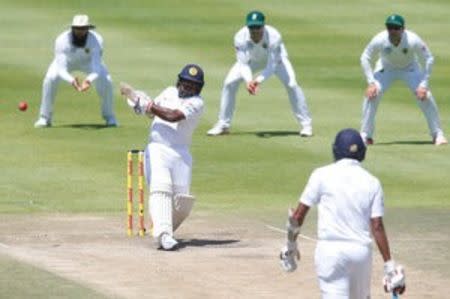 Cricket - South Africa v Sri Lanka - Second Test cricket match - Newlands Stadium, Cape Town, South Africa - 5/1/17 - Sri Lanka's Rangana Herath plays a shot . REUTERS/Mike Hutchings