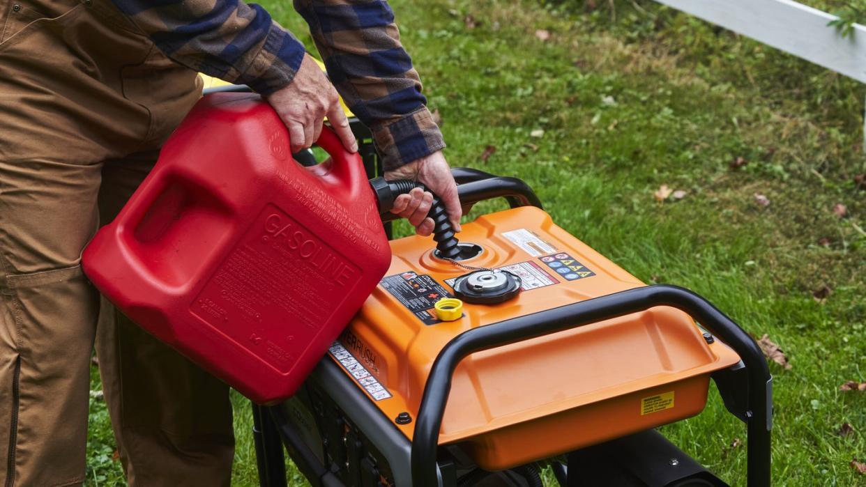 a person pushing a lawn mower