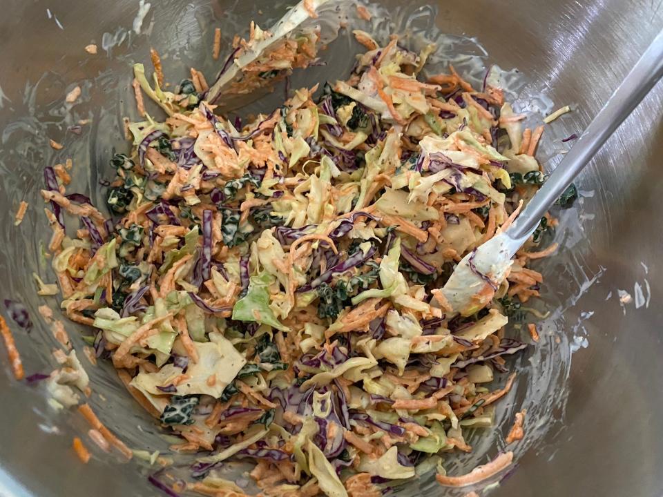 Finished coleslaw in a bowl.