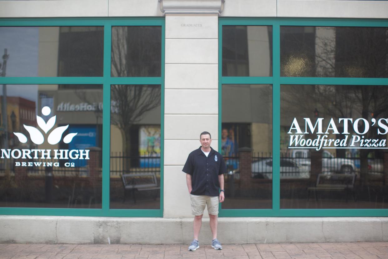 Amato's Woodfired Pizza Owner Brad Hampu is shown standing outside of the company's newest Marion location opening in partnership with Columbus-based North High Brewing.