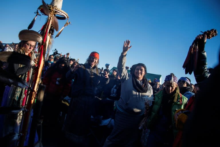 Activists celebrate at Oceti Sakowin Camp on the edge of the Standing Rock Sioux Reservation outside Cannon Ball, North Dakota, after hearing that the Army Corps of Engineers has denied the current route for the Dakota Access pipeline