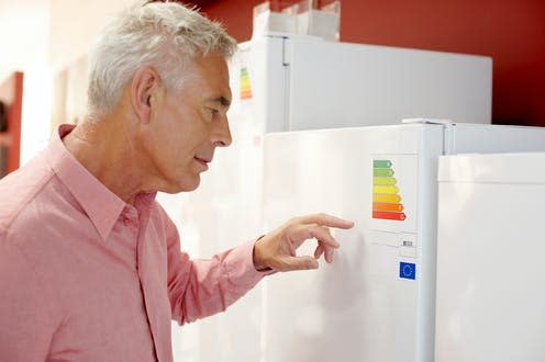 <span class="caption">Energy labels are useful, but they could be made more effective.</span> <span class="attribution"><a class="link " href="https://www.shutterstock.com/image-photo/senior-man-looking-fridge-freezers-electrical-1570328149" rel="nofollow noopener" target="_blank" data-ylk="slk:Shutterstock;elm:context_link;itc:0;sec:content-canvas">Shutterstock</a></span>