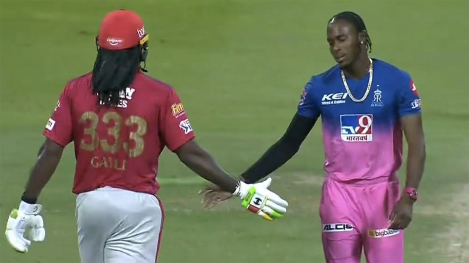Chris Gayle is pictured shaking hands with Jofra Archer.