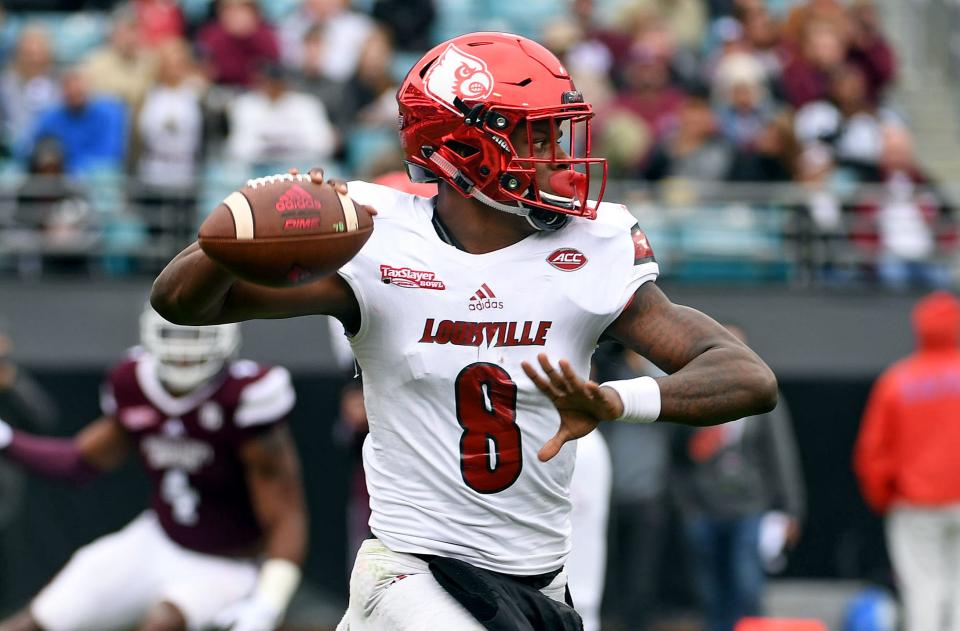 Lamar Jackson in action during a 2017 Louisville game. His No. 8 jersey is being retired by the football team.