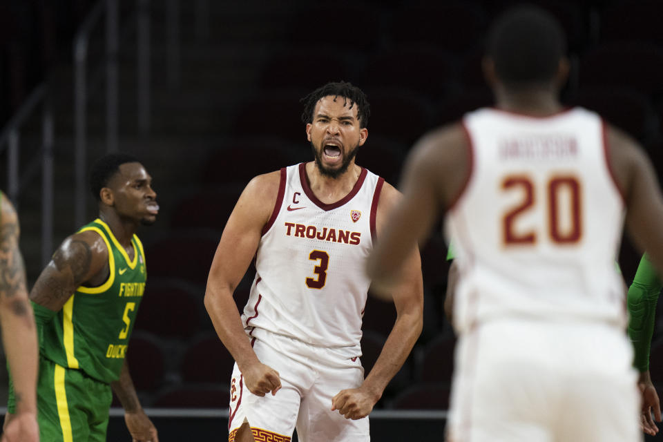 Southern California's Isaiah Mobley, center, celebrates his basket during the first half of an NCAA college basketball game against Oregon Saturday, Jan. 15, 2022, in Los Angeles. (AP Photo/Jae C. Hong)