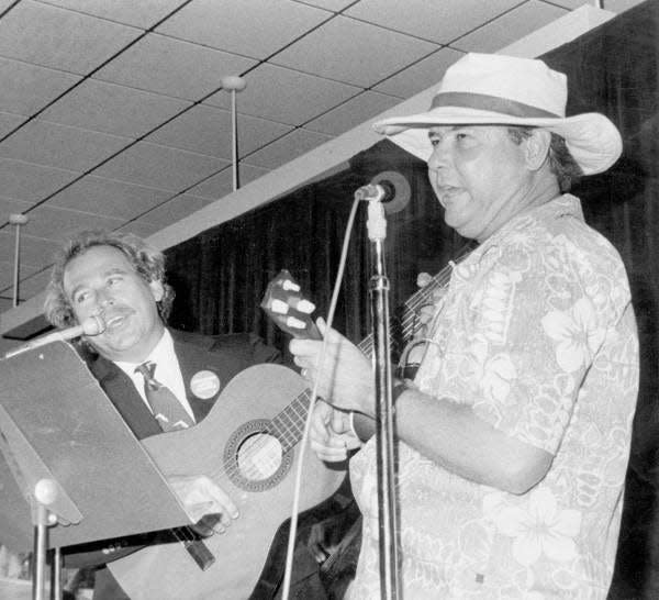 Gov. Bob Graham, right, dressed like Jimmy Buffett and Buffett wore Graham’s trademark Florida tie and pinstripe suit during a performance in 1984 at the Press Corps Skits in Tallahassee.