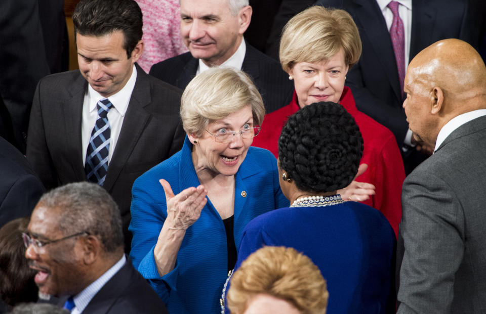 Sen. Elizabeth Warren (D-Mass.) speaks with Rep. Sheila Jackson Lee (D-Texas) as senators arrive for President Barack Obama's State of the Union address in the Capitol on Jan. 20, 2015.