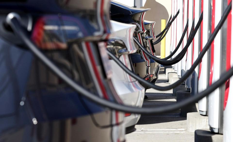 PHOTO: Tesla electric cars recharge at a Tesla Supercharger station on Jan. 16, 2024 in Burbank, Calif. (Mario Tama/Getty Images, FILE)