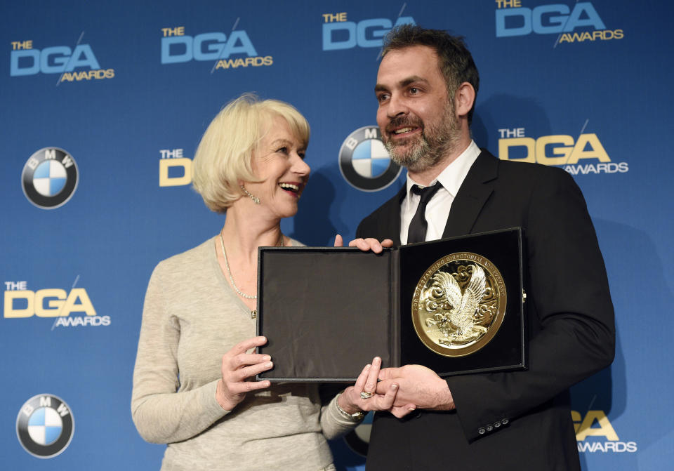 Miguel Sopochnik, right, director of the "The Battle of the Bastards" episode of "Game of Thrones," poses backstage with his Dramatic Series award along with presenter Helen Mirren at the 69th Annual Directors Guild of America Awards at the Beverly Hilton on Saturday, Feb. 4, 2017, in Beverly Hills, Calif. (Photo by Chris Pizzello/Invision/AP)