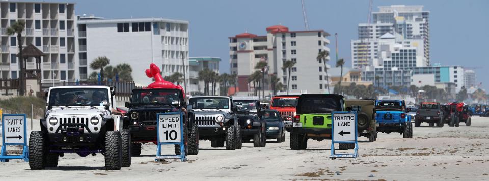 Jeeps cruise the World's Most Famous Beach during Jeep Beach 2022. The annual event for Jeep lovers returns April 22-30 in Daytona Beach.