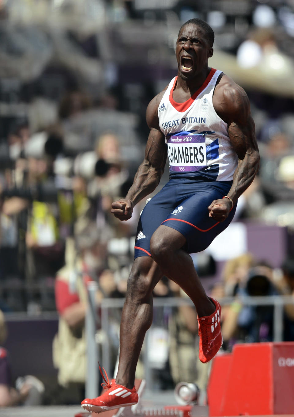 Britain's Dwain Chambers celebrates after finishing first in his men's 100m round 1 heats at the London 2012 Olympic Games at the Olympic Stadium August 4, 2012. REUTERS/Dylan Martinez (BRITAIN - Tags: OLYMPICS SPORT ATHLETICS TPX IMAGES OF THE DAY) 