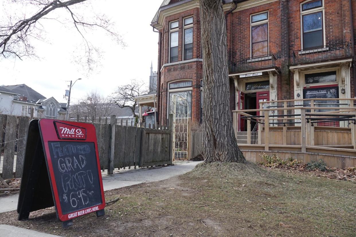 The Grad Club at Queen's University in Kingston, Ont., has been a campus landmark for decades. The university, which owns the building, plans to raise the rent by more than 300 per cent over the next five years. (Dan Taekema/CBC - image credit)