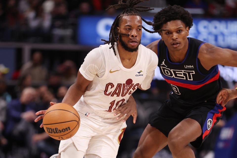 Cavaliers guard Darius Garland drives around Pistons forward Ausar Thompson during the first half on Friday, March 1, 2024, at Little Caesars Arena.