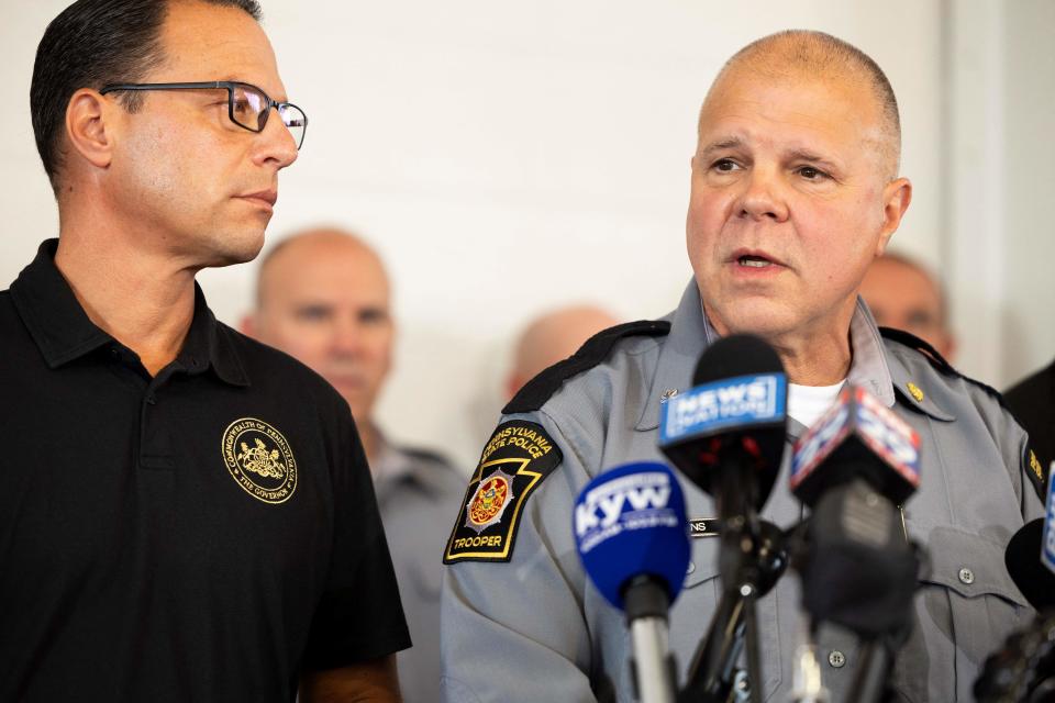 Pennsylvania State Police Lt. Col. George Bivens, right, and Pennsylvania Gov. Josh Shapiro at a press conference 