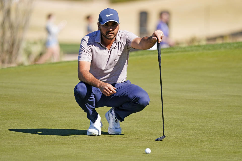 Jason Day lines up his putt on the 15th hole during the second round of the Phoenix Open golf tournament Friday Feb. 10, 2023, in Scottsdale, Ariz. (AP Photo/Darryl Webb)