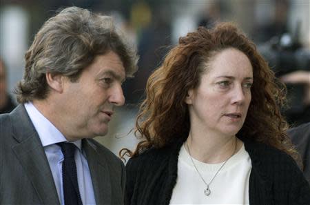 Former News International chief executive Rebekah Brooks and her husband Charlie arrives at the Old Bailey courthouse in London November 13, 2013. REUTERS/Neil Hall