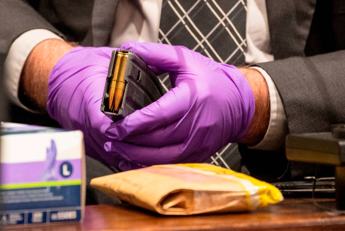 Jeff Croft, a SLED senior special agent holds onto a clip of .300 Blackout casings while on the witness stand in the double murder trial of Alex Murdaugh at the Colleton County Courthouse in Walterboro, Monday, Jan. 30, 2023. Andrew J. Whitaker/The Post and Courier/Pool