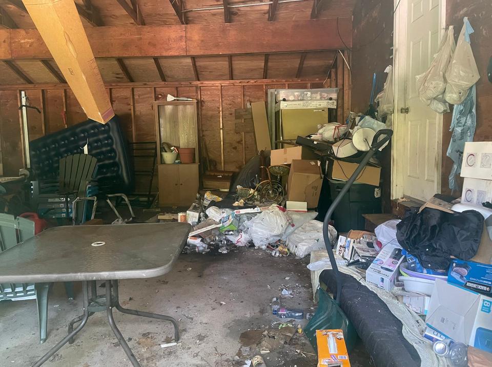 Neighbors are irked the town has let a property it owns at 21 Darcy Road go into disrepair. The property has a rat infestation problem and is cluttered with trash.