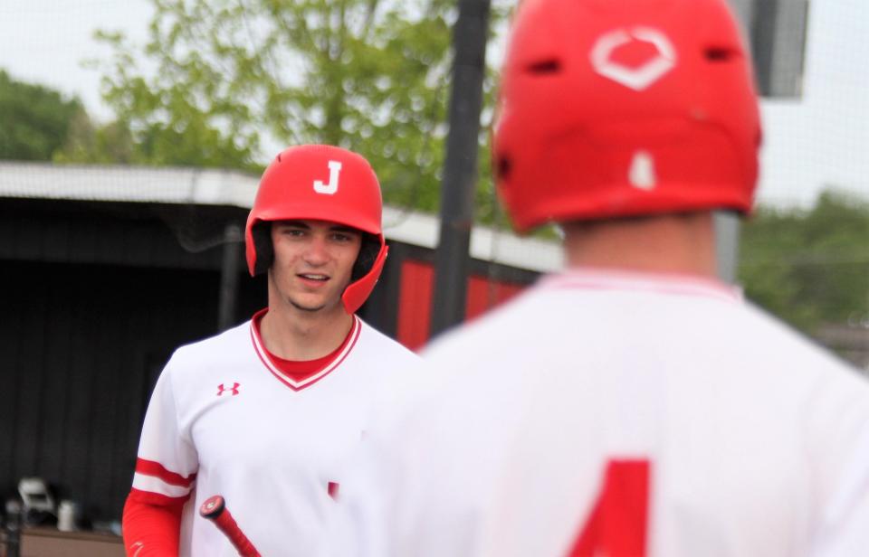 Jacksonville senior shortstop Garrett Meyer returns to the dugout after scoring a run against Lanphier in a Central State Eight Conference baseball game on Wednesday, May 18.