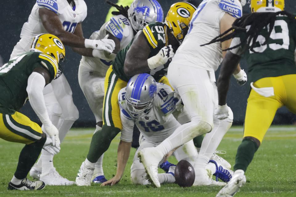 Detroit Lions' Jared Goff fumbles during the second half of an NFL football game against the Green Bay Packers Monday, Sept. 20, 2021, in Green Bay, Wis. (AP Photo/Mike Roemer)