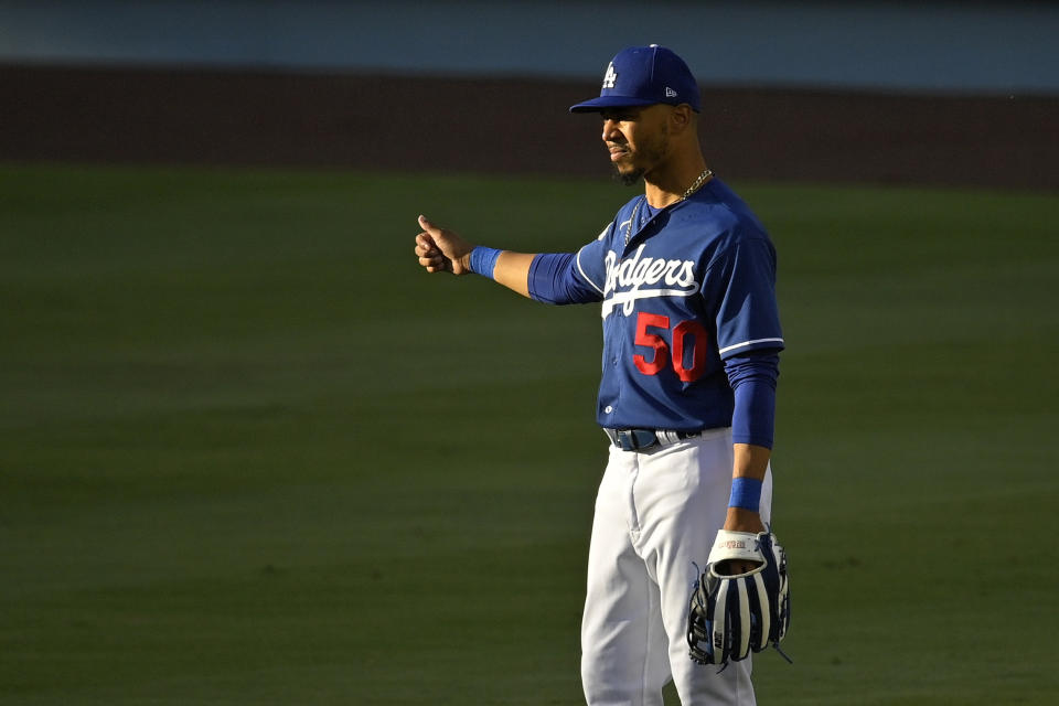 Los Angeles Dodgers' Mookie Betts stands in right field during baseball training Monday, July 6, 2020, in Los Angeles. (AP Photo/Mark J. Terrill)