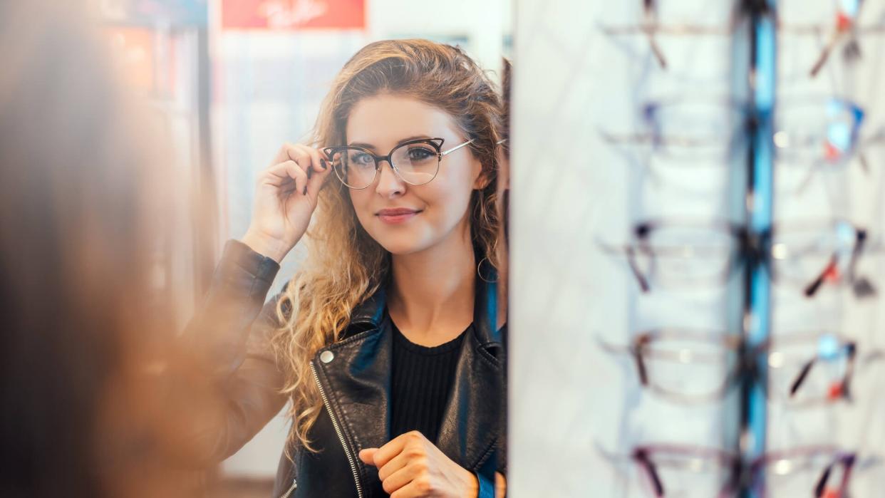 girl trying on glasses