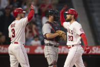 Los Angeles Angels' Jared Walsh, right, and Taylor Ward celebrates Walsh's two-run home run during the third inning of the team's baseball game against the Detroit Tigers in Anaheim, Calif., Saturday, June 19, 2021. (AP Photo/Kyusung Gong)