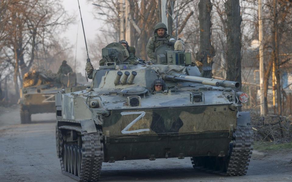 Russian soldiers are seen on a tank in Volnovakha district in the pro-Russian separatists-controlled Donetsk, in Ukraine on March 26, 2022. - Anadolu Agency/Anadolu