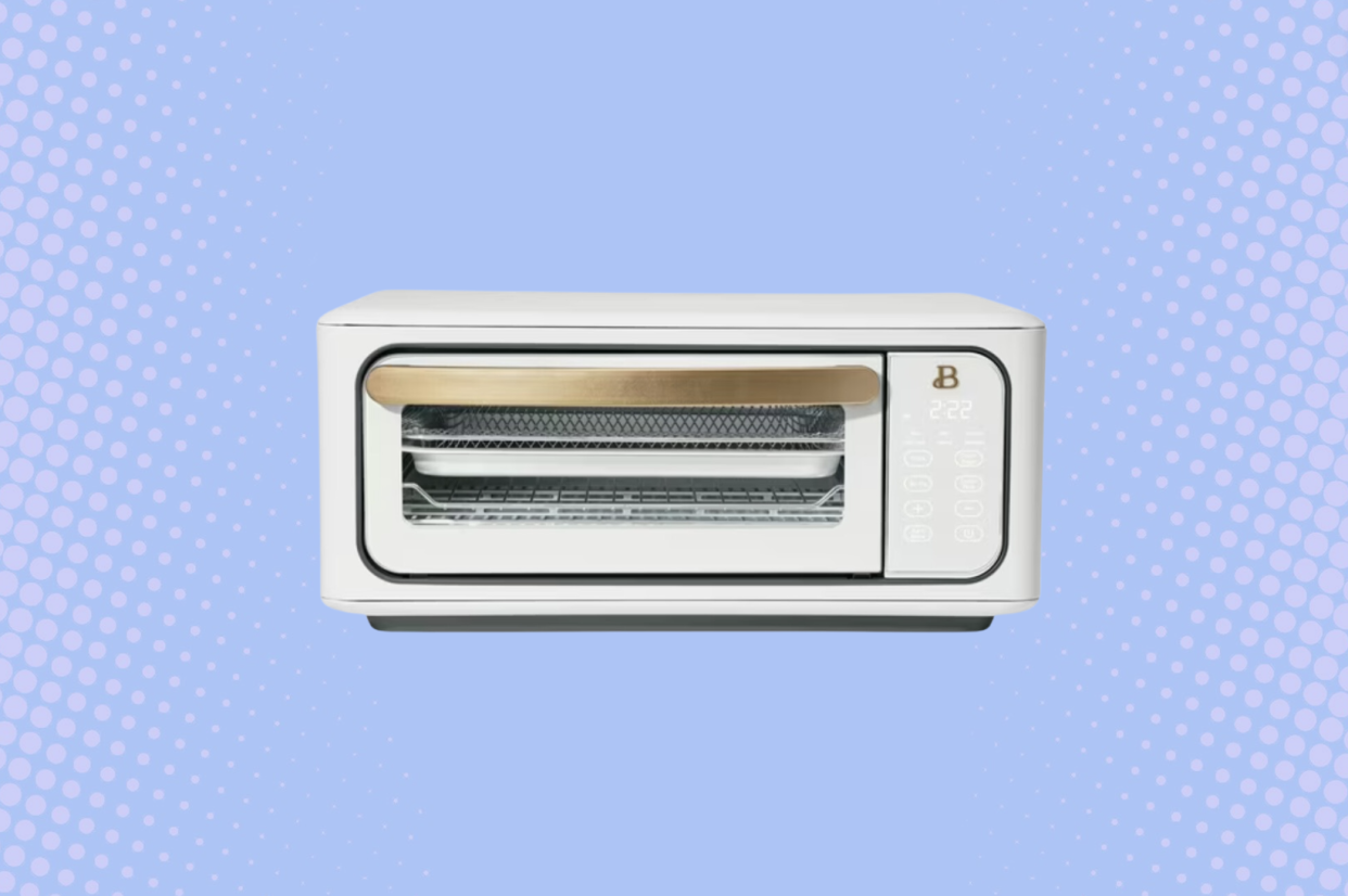 Stock photo of the Beautiful Infrared Air Fry Toaster Oven against a blue background