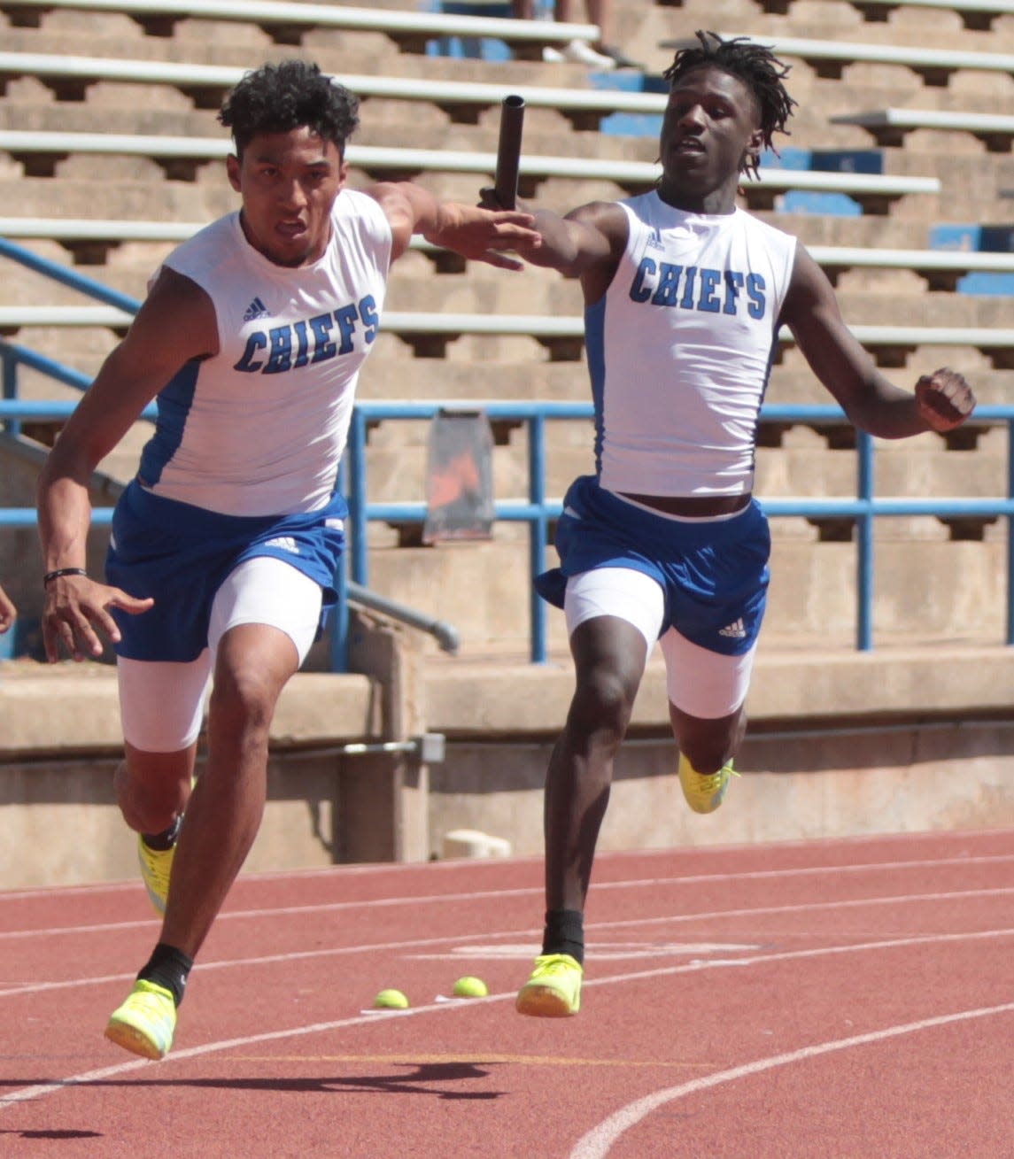 San Angelo Lake View's Brandon Durio, right, passes the baton to teammate Derrick Taylor in the boys 4x200-meter relay at the District 3-4A Track and Field Meet Thursday, April 14, 2022, at San Angelo Stadium.