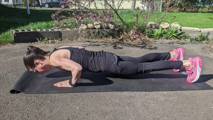 Woman demonstrates a proper push-up