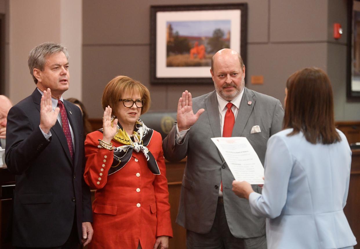From left to right: Tim Culp, Shelley Sweatt and Clay Cash are sworn in as member of the Texas Tech University System Board of Regents by vice chairwoman Ginger Kerrick Davis, Thursday, May 4, 2023, at the Texas Tech University System Admin Building.