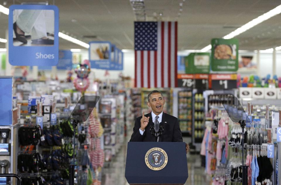 President Barack Obama speaks at a Walmart store in Mountain View, Calif., Friday, May 9, 2014. Obama announced new steps by companies, local governments and his own administration to deploy solar technology, showcasing steps to combat climate change that don't require consent from a disinclined Congress. (AP Photo/Jeff Chiu)