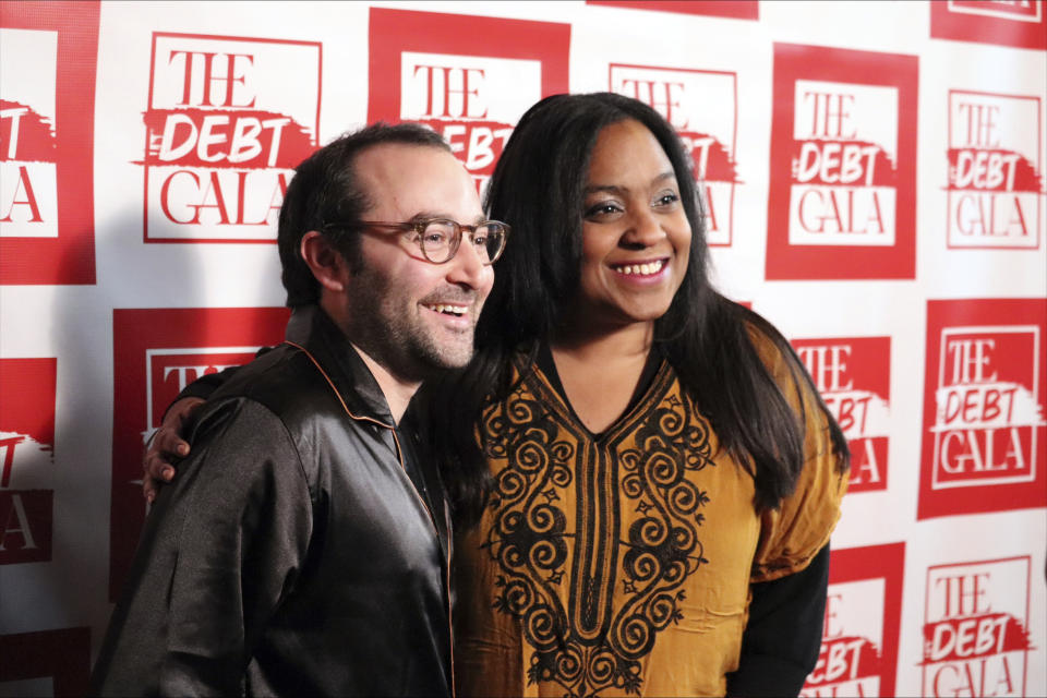 Show producer Adam Gold, left, and comedian Chanel Ali appear at the Debt Gala in the Brooklyn borough of New York on Sunday, May 5, 2024. Some 200 attendees sought to help alleviate medical debt at the second annual benefit, one of several alternative fundraisers that have popped up around the star-studded Met Gala. (AP Photo/James Pollard)