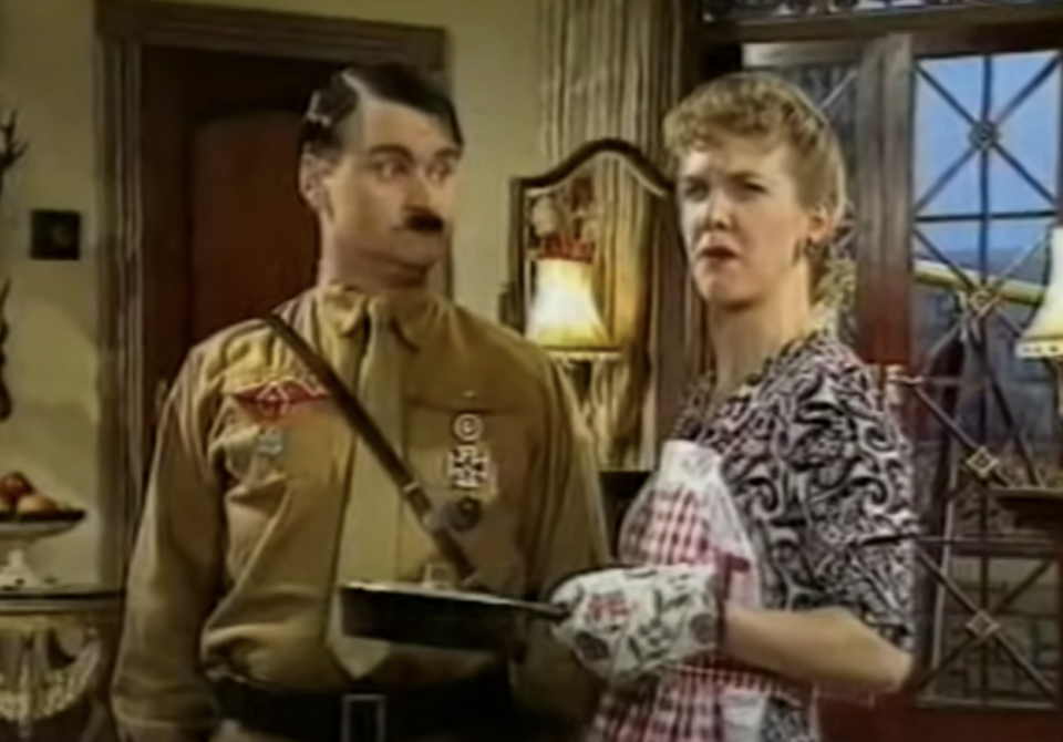 closeup of the characters as hitler and his wife